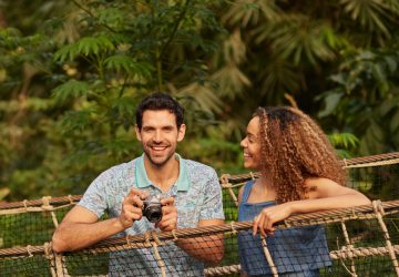 Man and women on rope bridge