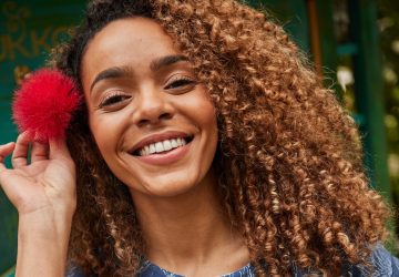 Women Smiling with a flower in her hair