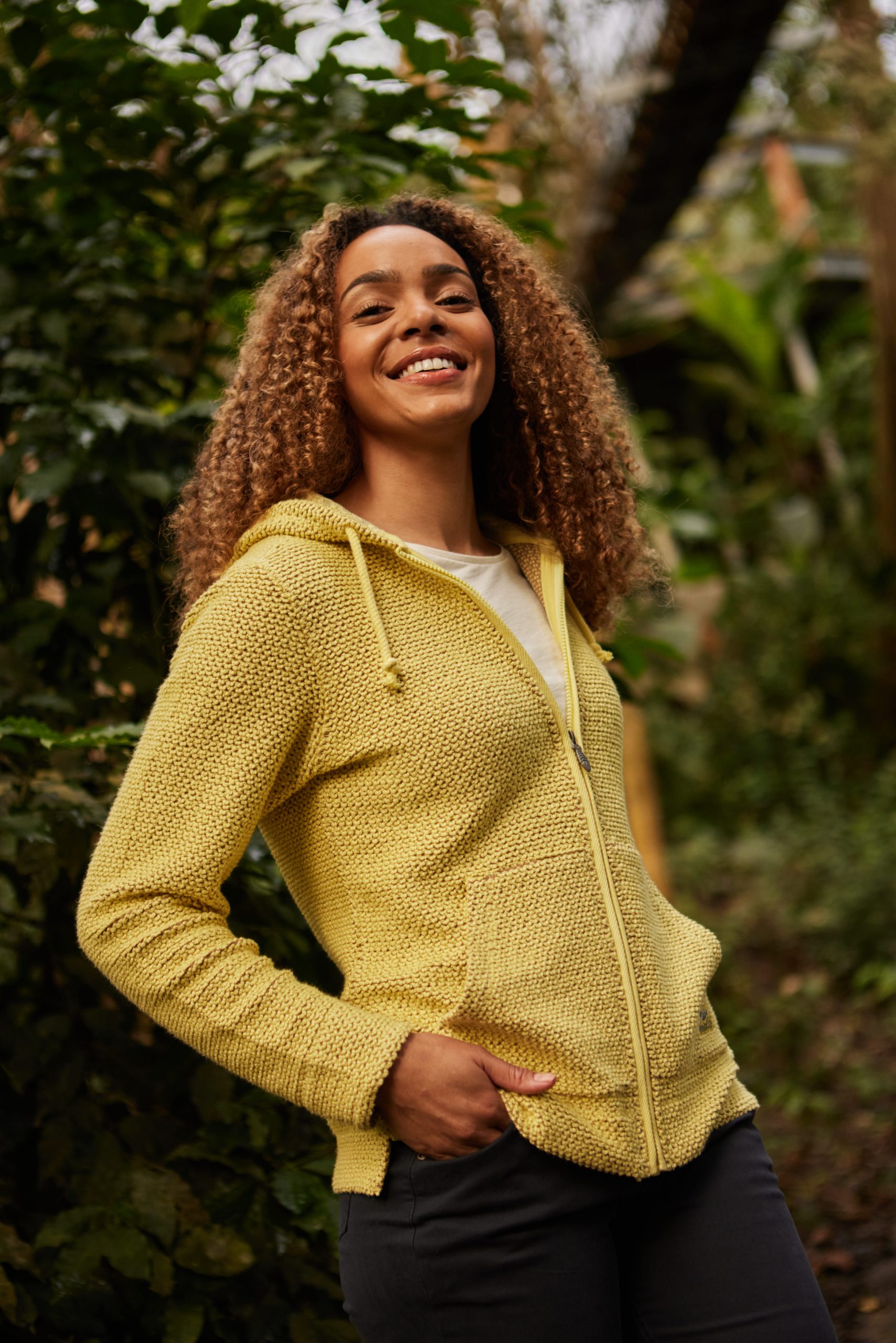 Women outdoors wearing a yellow jacket
